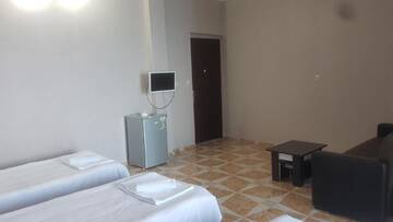 Фото номера Четырехместный номер &quot;Комфорт&quot; Отель Hotel Kvariati Nugo г. Квариати 7